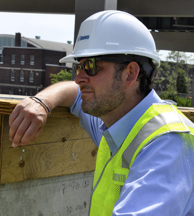 David O'Hara in hard hat and safety vest at construction site