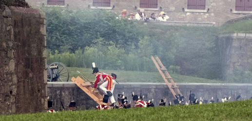 Re-enactors firing muskets
