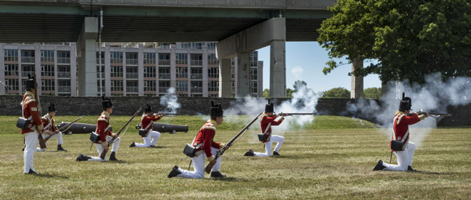 Soldiers with muskets held at high port
